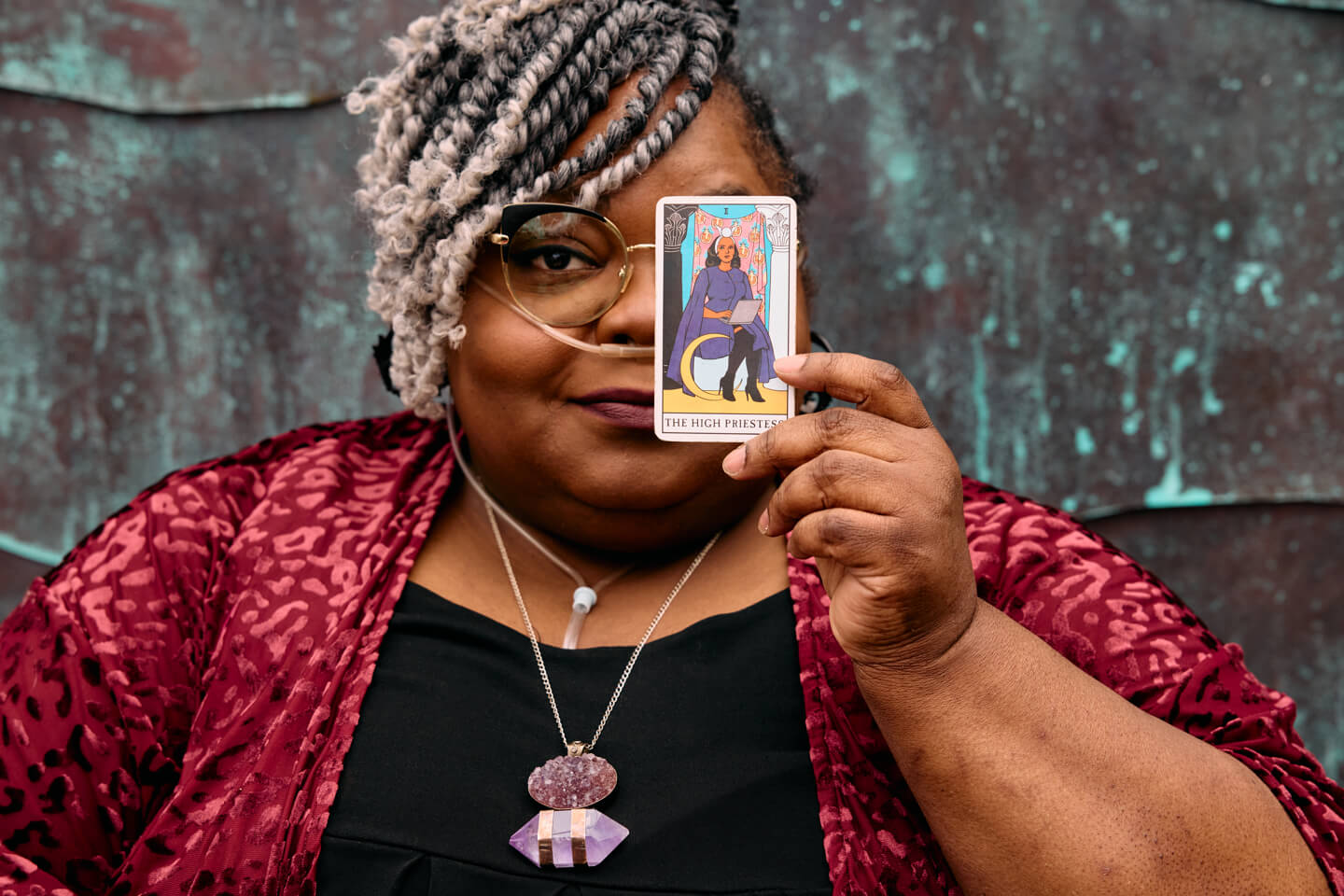 Renée holding tarot card