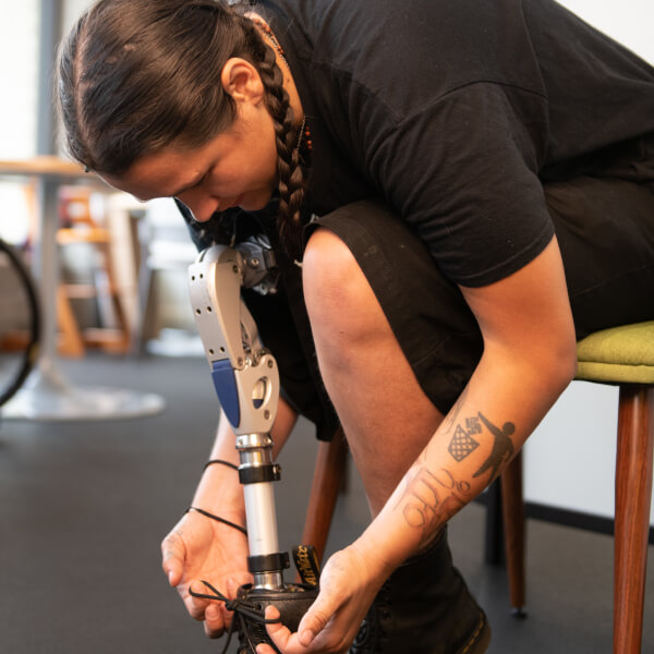 Tying shoelaces on prosthetic leg